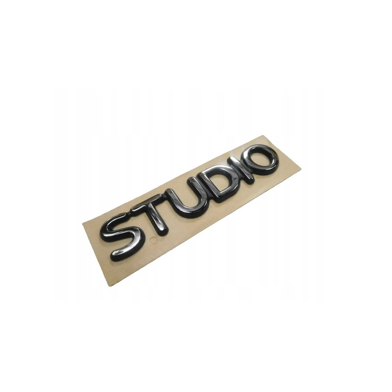 ZNACZEK EMBLEMAT STUDIO FORD FIESTA 96-02 OE 1007569