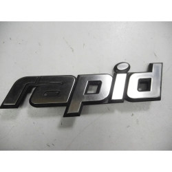 Emblemat Renault Rapid OE 7700815571