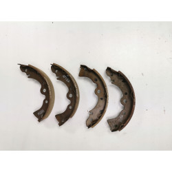 Zestaw szczęk hamulcowych tył Nissan PRAIRIE OE 44060-04A25