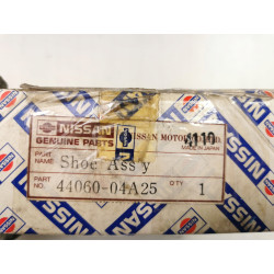 Zestaw szczęk hamulcowych tył Nissan PRAIRIE OE 44060-04A25