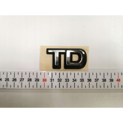 Emblemat logo tył klapy Opel Corsa B Vectra A "TD" OE 90444439
